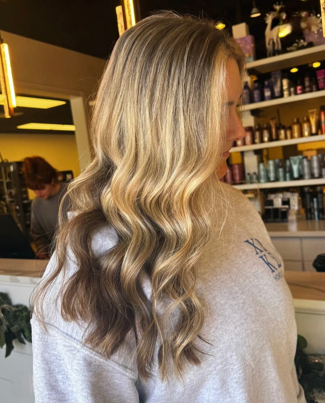 Dimensional blonde highlights finished with a gloss — hair by Lili Barker in Leander, TX